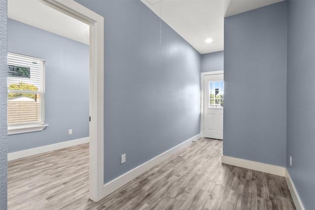 unfurnished room featuring light hardwood / wood-style floors