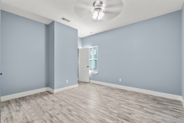 spare room with light hardwood / wood-style floors and ceiling fan