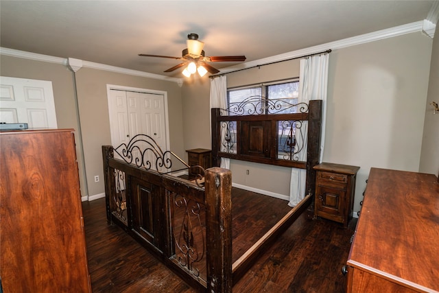 bedroom featuring ceiling fan, ornamental molding, a closet, and dark wood-type flooring