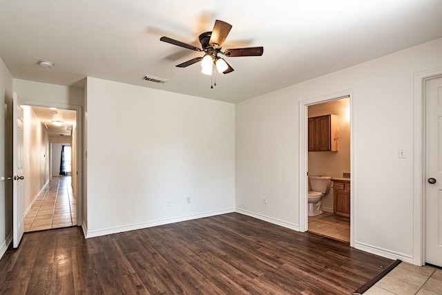 unfurnished room featuring light wood-type flooring and ceiling fan