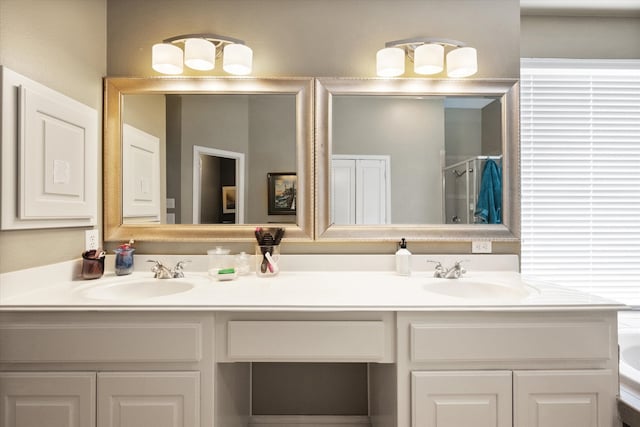 bathroom featuring vanity and an enclosed shower