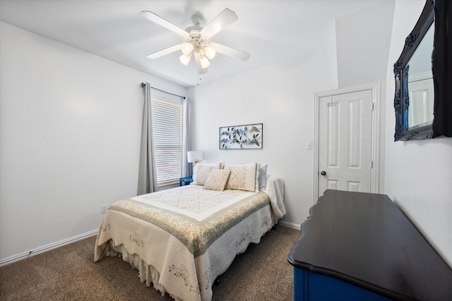 bedroom featuring ceiling fan and dark carpet