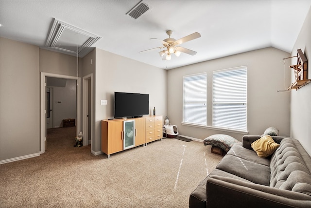 carpeted living room featuring ceiling fan and vaulted ceiling