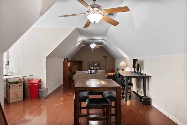 dining space featuring ceiling fan, lofted ceiling, and dark hardwood / wood-style floors