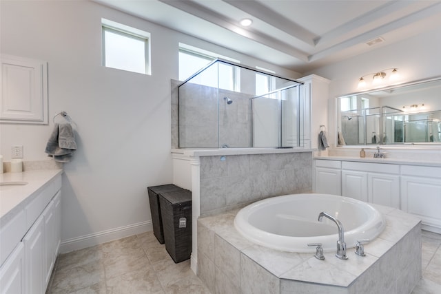 bathroom featuring tile patterned flooring, plus walk in shower, and vanity