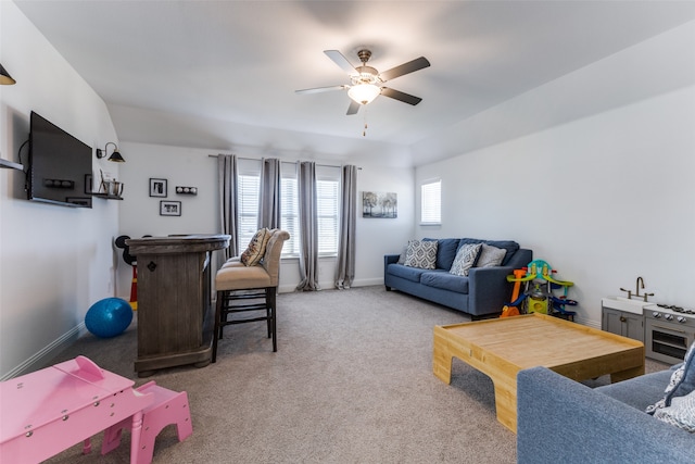 living room featuring carpet floors and ceiling fan