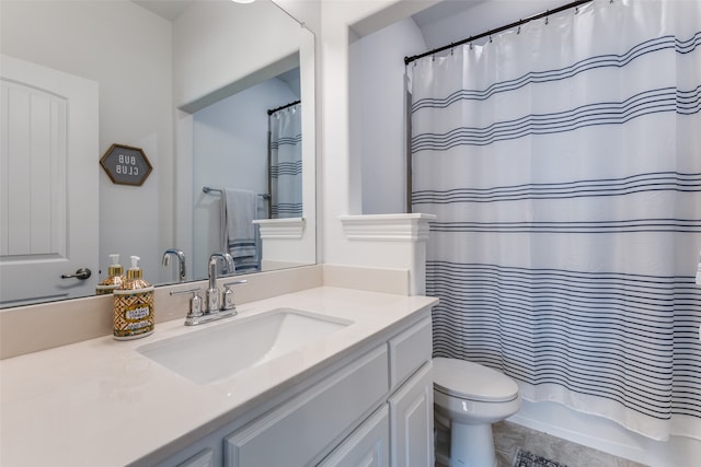 full bathroom with shower / bathtub combination with curtain, vanity, and toilet