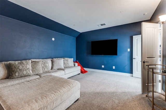 living room with vaulted ceiling and carpet flooring