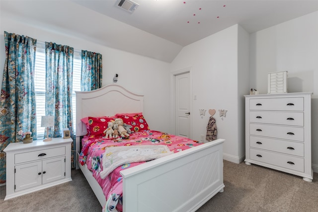 carpeted bedroom with lofted ceiling