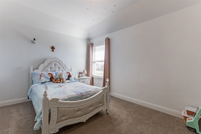 bedroom with vaulted ceiling and carpet