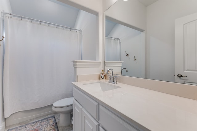 full bathroom featuring vanity, shower / tub combo, and toilet