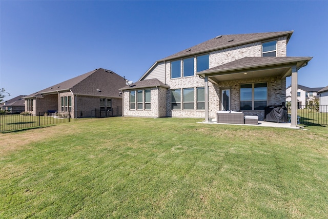 rear view of property with an outdoor hangout area, a lawn, and a patio area