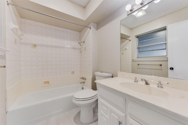 full bathroom featuring tile patterned floors, toilet, vanity, and tiled shower / bath