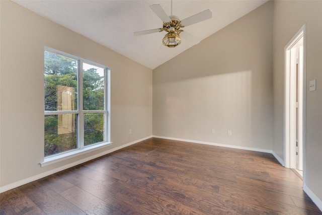 unfurnished room with a textured ceiling, ceiling fan, dark wood-type flooring, and vaulted ceiling