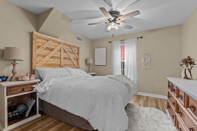 bedroom with ceiling fan and light hardwood / wood-style flooring