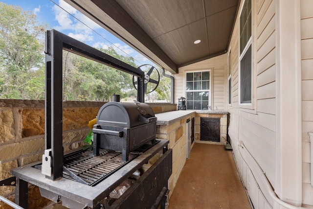 view of patio with an outdoor kitchen and area for grilling