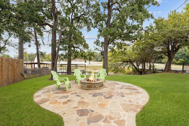 view of yard featuring a patio and a fire pit