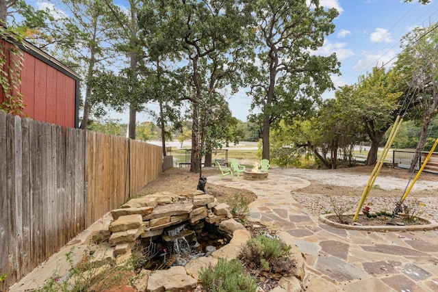 view of patio / terrace with a hot tub