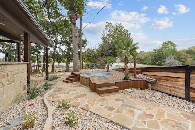 view of patio with a hot tub