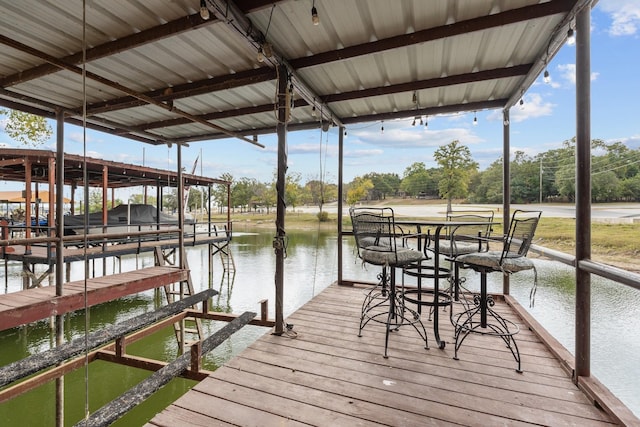 dock area with a water view