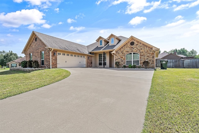 view of front of home with a garage and a front yard