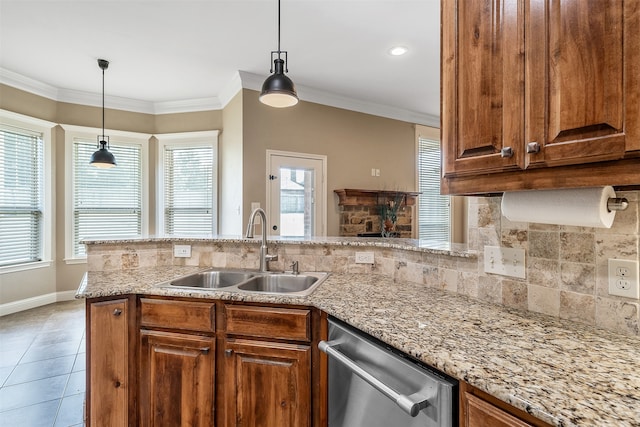 kitchen featuring dishwasher, kitchen peninsula, plenty of natural light, and sink