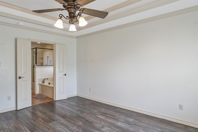 unfurnished bedroom with ceiling fan, ornamental molding, a tray ceiling, and dark wood-type flooring