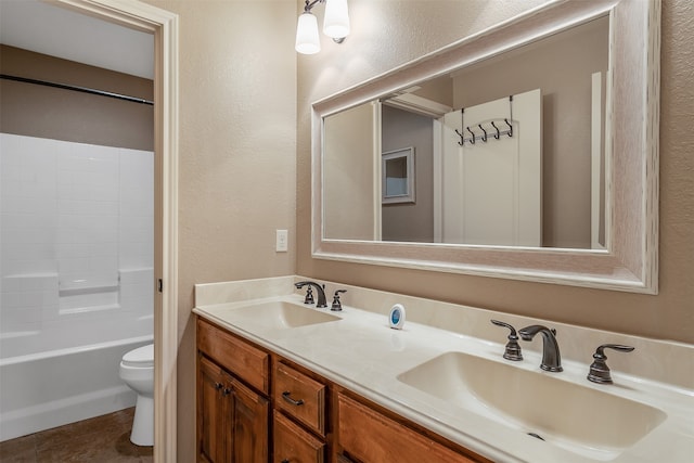 full bathroom featuring tub / shower combination, vanity, toilet, and tile patterned floors