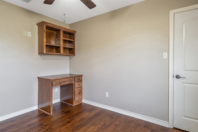 unfurnished office featuring ceiling fan and dark wood-type flooring