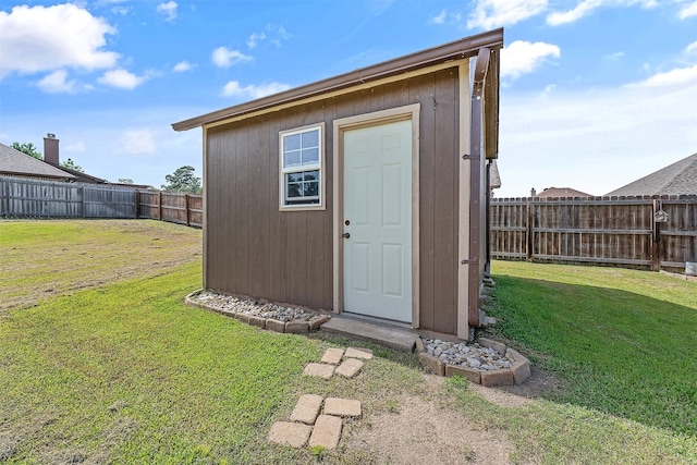 view of outdoor structure with a yard