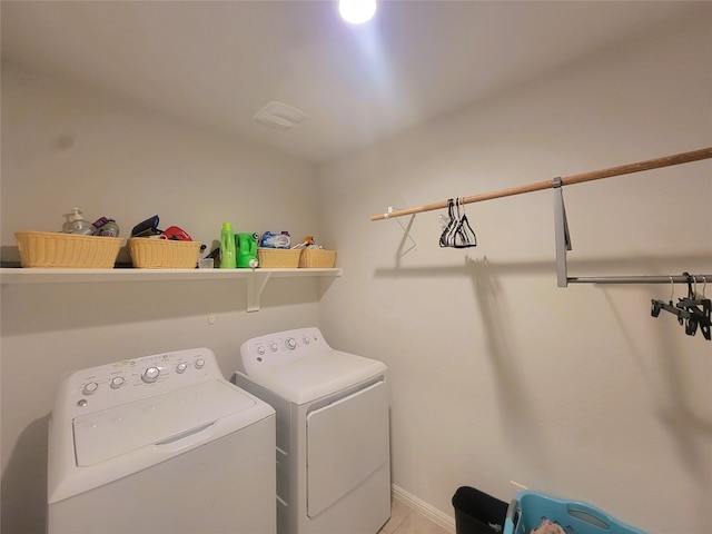 washroom featuring washer and clothes dryer