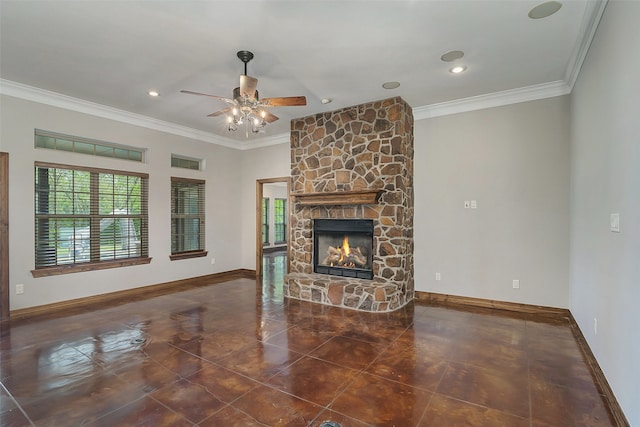 unfurnished living room with dark tile patterned flooring, crown molding, a fireplace, and ceiling fan