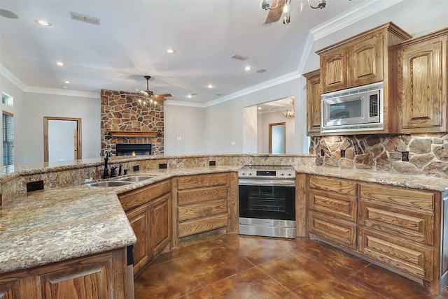 kitchen featuring tasteful backsplash, sink, ornamental molding, ceiling fan, and stainless steel appliances