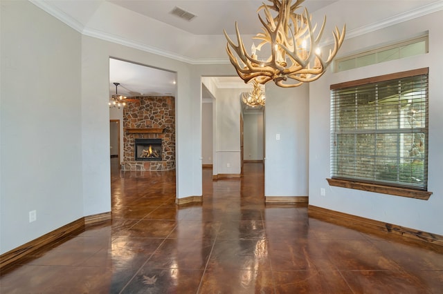 unfurnished dining area featuring ornamental molding, a stone fireplace, and a notable chandelier