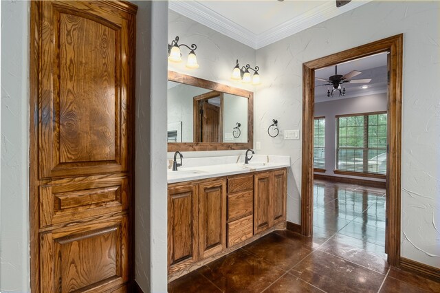 bathroom with vanity, crown molding, and ceiling fan