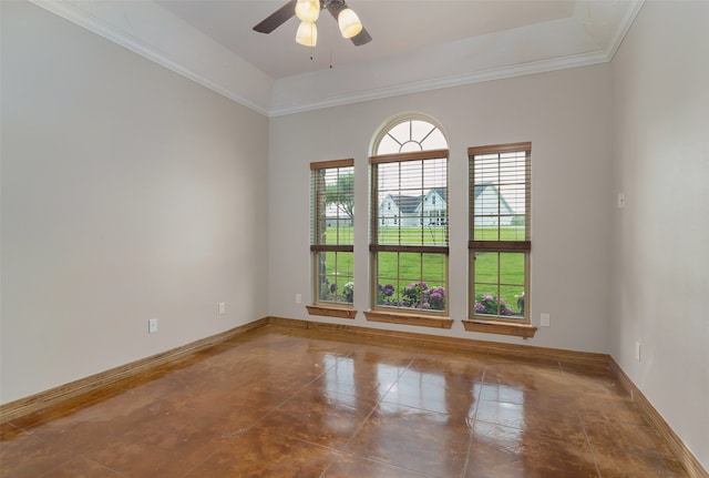 spare room with crown molding, a raised ceiling, and ceiling fan