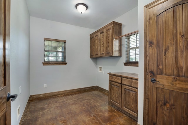 washroom with cabinets and washer hookup