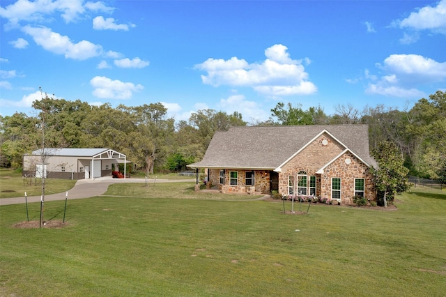 view of front of property with a carport and a front yard