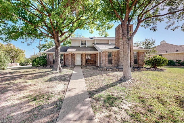 view of property featuring a front yard