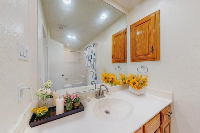 bathroom featuring shower / bathtub combination with curtain and vanity