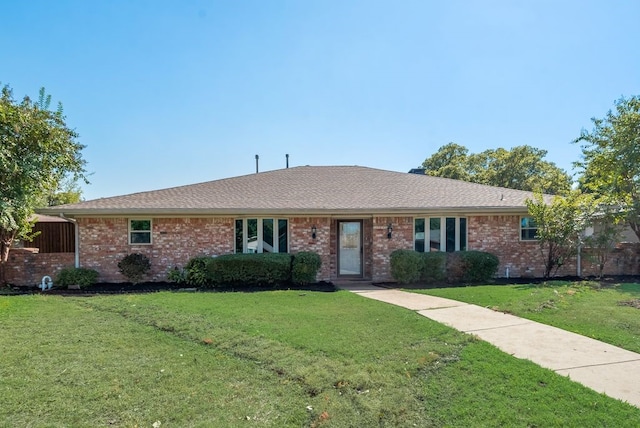 single story home featuring a front yard