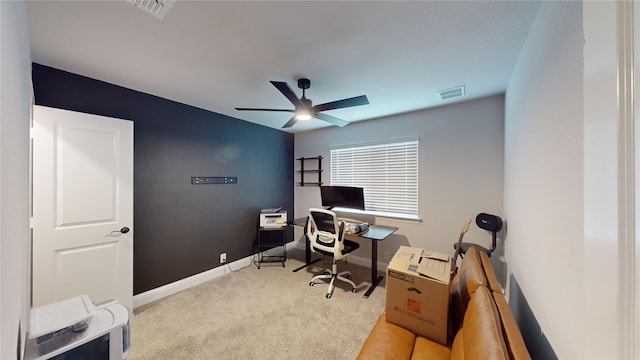 office space with ceiling fan and light carpet