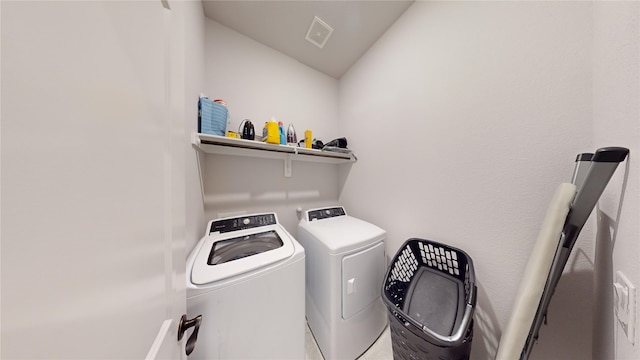 clothes washing area featuring washer and dryer