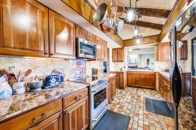 kitchen featuring tasteful backsplash, vaulted ceiling with beams, stainless steel appliances, and light stone countertops