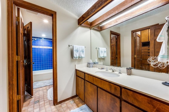 bathroom featuring vanity and a textured ceiling