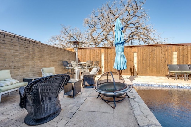 view of patio / terrace featuring a fire pit