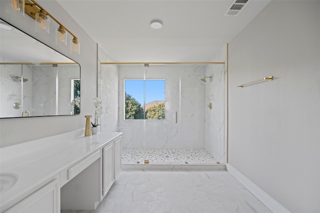 bathroom with vanity and a shower with shower door