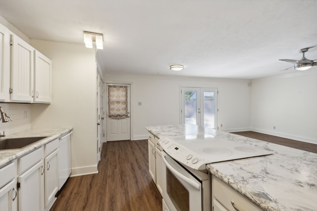 kitchen with white cabinets, white appliances, dark wood-type flooring, and sink