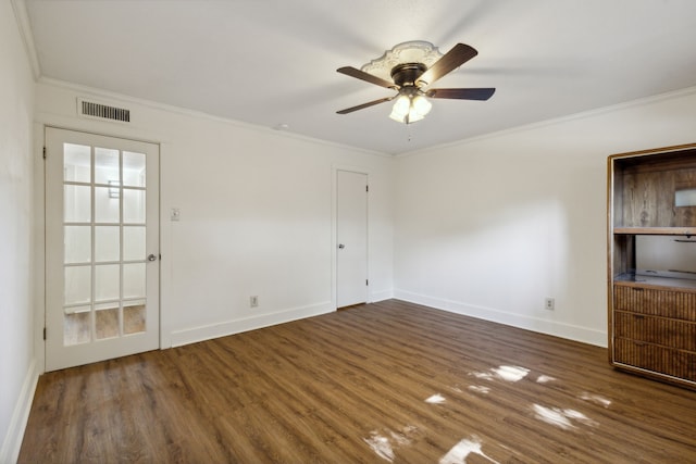 spare room with ornamental molding, dark hardwood / wood-style floors, and ceiling fan