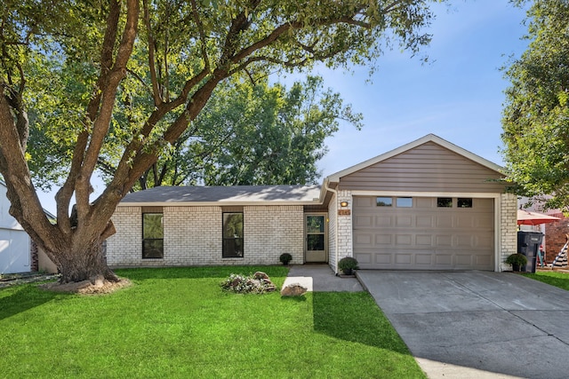 single story home featuring a garage and a front lawn